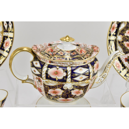 220 - A Royal Crown Derby Imari 2451 pattern tea set, 1925, comprising a teapot, milk jug, sugar bowl, twe... 