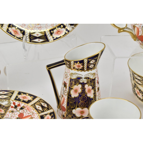 220 - A Royal Crown Derby Imari 2451 pattern tea set, 1925, comprising a teapot, milk jug, sugar bowl, twe... 