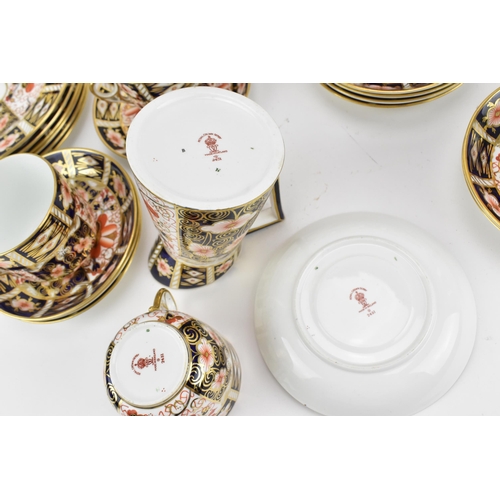 220 - A Royal Crown Derby Imari 2451 pattern tea set, 1925, comprising a teapot, milk jug, sugar bowl, twe... 