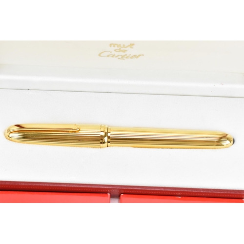 223 - A Must De Cartier Stylo fountain pen, in gold coloured mount, with 18ct yellow gold nib stamped 750,... 