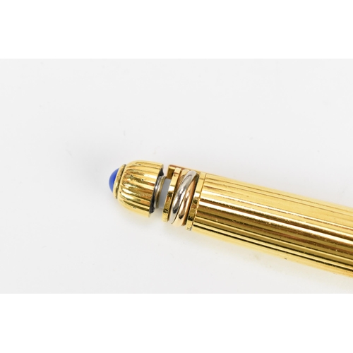 226 - Two Must De Cartier Stylo pens, one in gold plated mount numbered 005001, the other in gold colour a... 