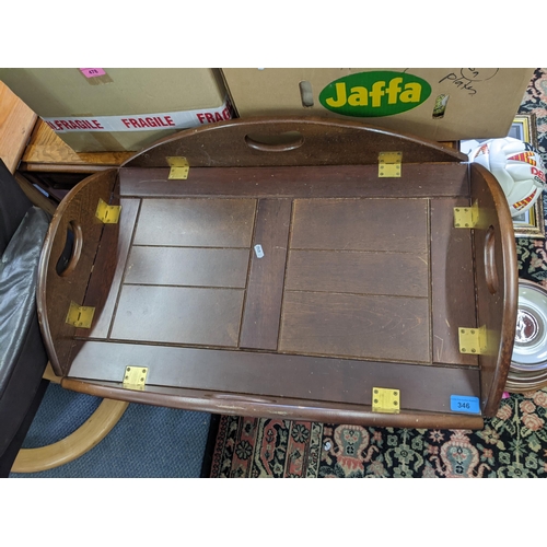 346 - A reproduction mahogany butlers tray topped coffee table with hinged sides and on square moulded sup... 