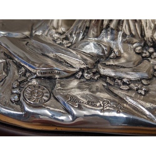 486 - An Italian silver plated model of a horse signed Marcello Giorgio on a naturalistic base and wooden ... 