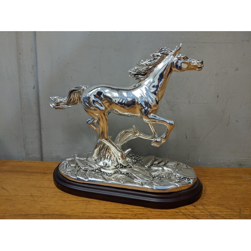 486 - An Italian silver plated model of a horse signed Marcello Giorgio on a naturalistic base and wooden ... 