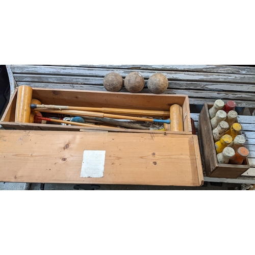 499 - THIS LOT HAS BEEN WITHDRAWN

A Slazengers London croquet set together with a set of skittles and thr... 