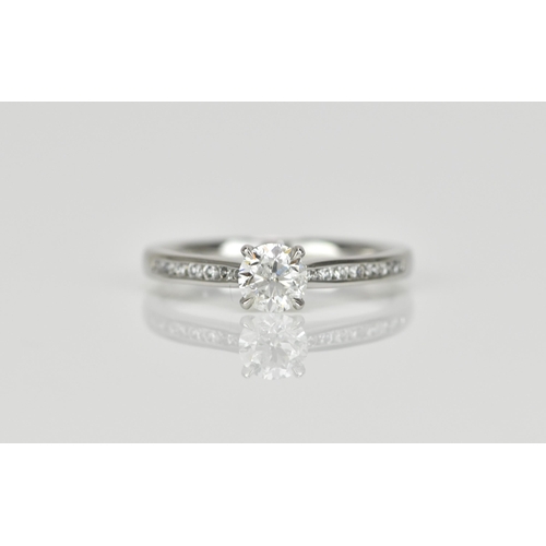 286 - A platinum and solitaire diamond engagement ring, designed with central brilliant cut stone approx. ... 