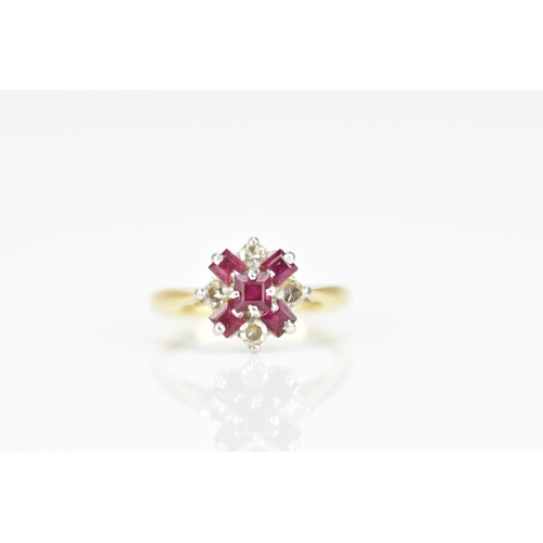 291 - An 18ct yellow gold, platinum, diamond and ruby floral cluster ring, set with five step cut rubies a... 