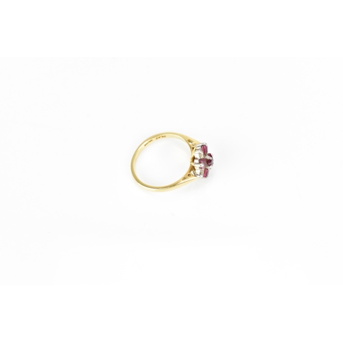 291 - An 18ct yellow gold, platinum, diamond and ruby floral cluster ring, set with five step cut rubies a... 