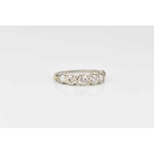 294 - An 18ct white gold seven stone diamond half eternity ring, the pave set round brilliant cut stones s... 