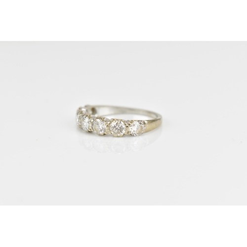 294 - An 18ct white gold seven stone diamond half eternity ring, the pave set round brilliant cut stones s... 