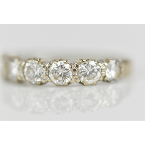 294 - An 18ct white gold seven stone diamond half eternity ring, the pave set round brilliant cut stones s... 