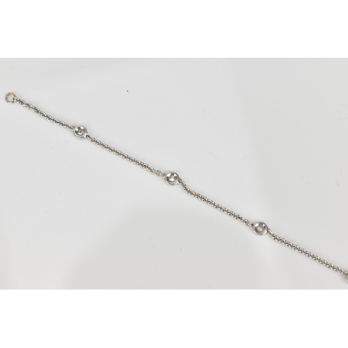 295 - An 18ct white gold and diamond bracelet, designed with a cable link chain with six interspersed beze... 