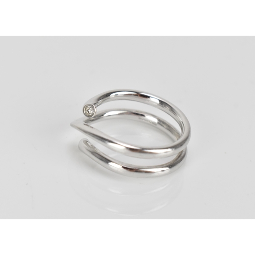 296 - Georg Jensen- An 18ct white gold and diamond 'magic' ring, designed by Regitze Overgaard, with a dia... 