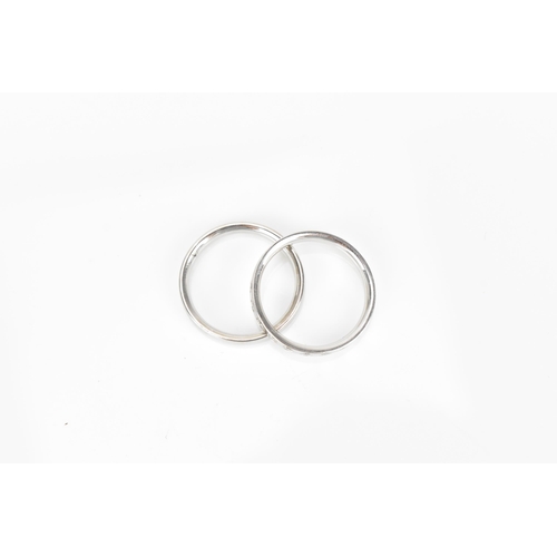 297 - Georg Jensen- Two 18ct white gold bands, one set with nine interspersed  brilliant cut diamonds, siz... 