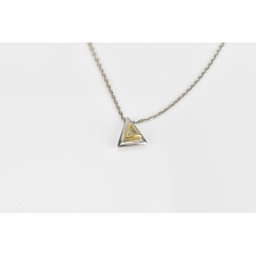 300 - An 18ct white gold, yellow gold and diamond pendant on chain, with matching earrings, the pendant an... 