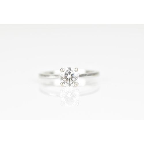 301 - An 18ct white gold and diamond solitaire ring, with central round brilliant cut stone approx 0.87 ca... 