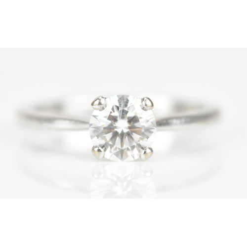 301 - An 18ct white gold and diamond solitaire ring, with central round brilliant cut stone approx 0.87 ca... 