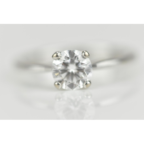 301 - An 18ct white gold and diamond solitaire ring, with central round brilliant cut stone approx 0.87 ca... 