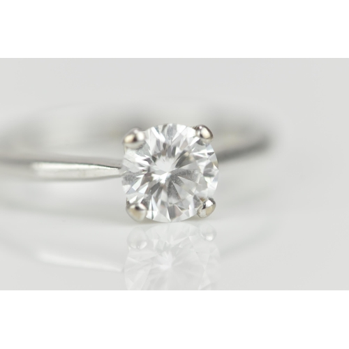 301 - An 18ct white gold and diamond solitaire ring, with central round brilliant cut stone approx 0.87 ca... 