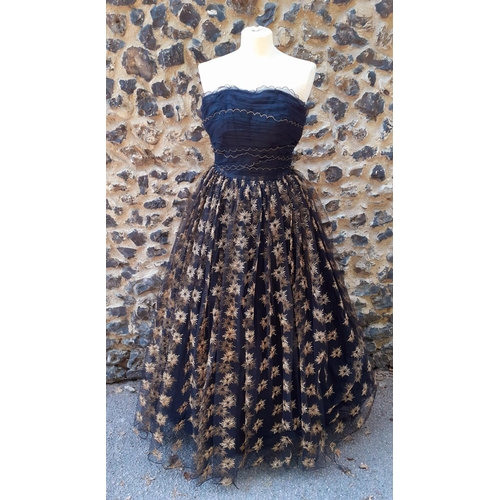 Frank Usher A 1950 s full length black netted evening gown having