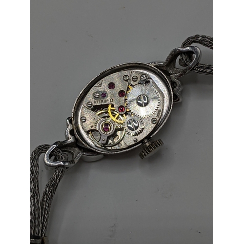 60 - A Filippe Girard manual wind, ladies 14k stamped white gold cased wristwatch inset with 24 diamonds,... 