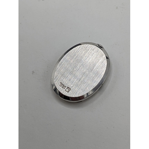 60 - A Filippe Girard manual wind, ladies 14k stamped white gold cased wristwatch inset with 24 diamonds,... 