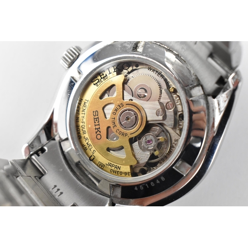 20 - A Seiko, automatic, gents, stainless steel wristwatch, circa 2017, model 4R36-03H0, having a black d... 