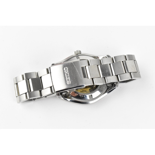 20 - A Seiko, automatic, gents, stainless steel wristwatch, circa 2017, model 4R36-03H0, having a black d... 