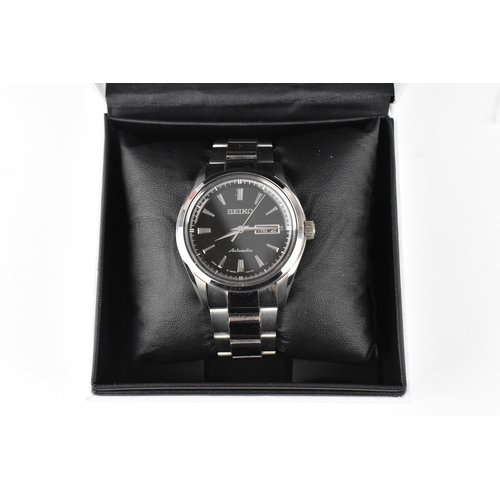 20 - A Seiko, automatic, gents, stainless steel wristwatch, circa 2017, model 4R36-03H0, having a black d... 