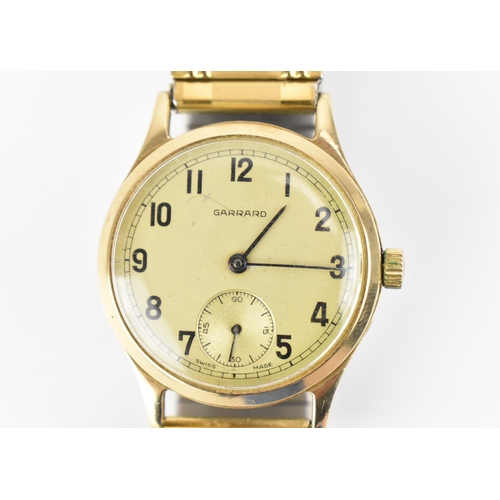 36 - A Garrard, manual wind, gents, 9ct gold wristwatch, the dial having Arabic numerals and subsidiary s... 