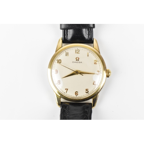 31 - An Omega, manual wind, gents, gold plated wristwatch, circa 1959, having a white dial with gilt Arab... 