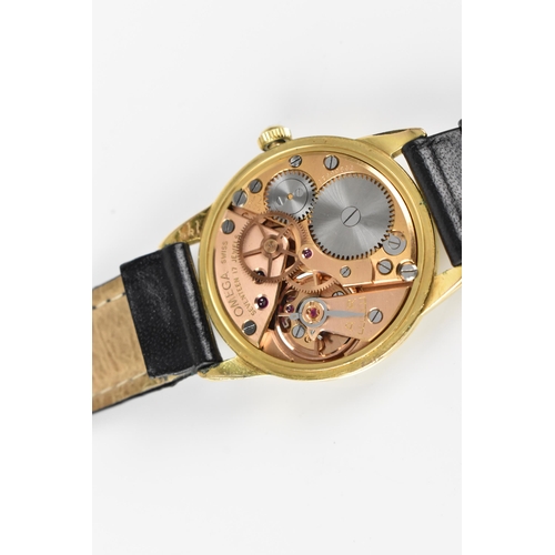 31 - An Omega, manual wind, gents, gold plated wristwatch, circa 1959, having a white dial with gilt Arab... 