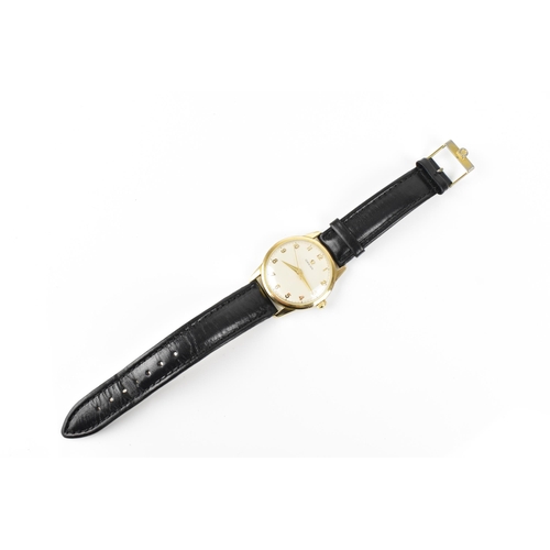 31 - An Omega, manual wind, gents, gold plated wristwatch, circa 1959, having a white dial with gilt Arab... 