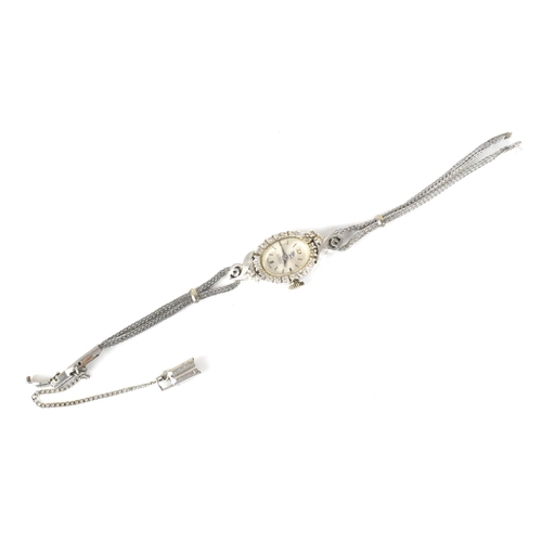 60 - A Filippe Girard manual wind, ladies 14k stamped white gold cased wristwatch inset with 24 diamonds,... 