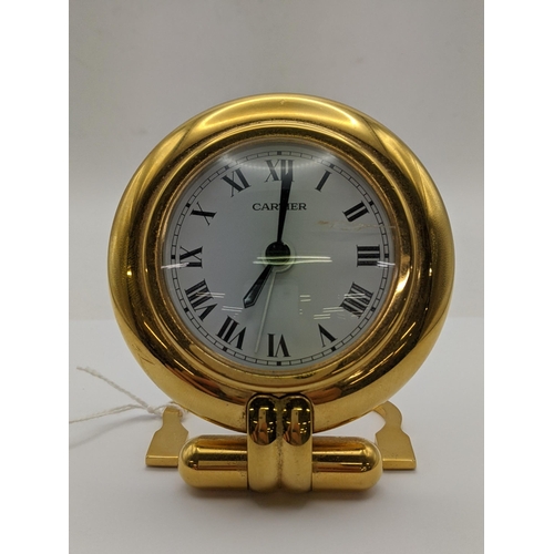 A Cartier quartz bedside travel clock the dial signed Cartier