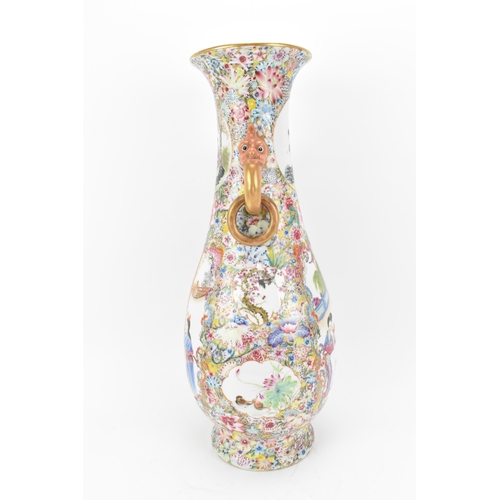 1 - A large Chinese Famille Rose baluster vase, Republic Period, decorated to the body with central figu... 