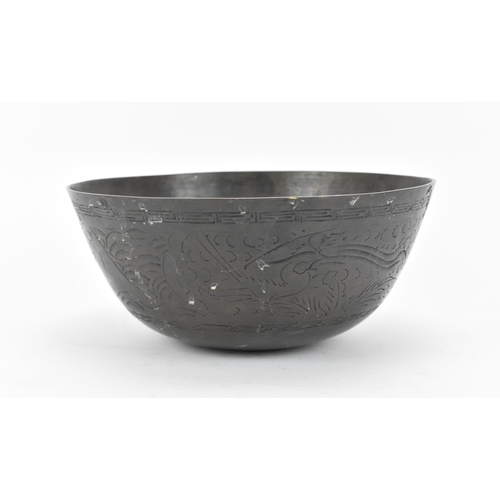 2 - A Chinese Ming bronze singing or rituals bowl, 15th century, designed with engraved dragon and phoen... 