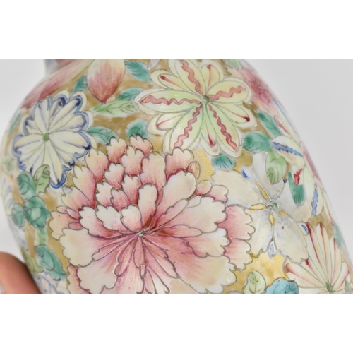 20 - A Chinese mille fleurs vase, Republic period, of ovoid shape decorated with large blooms and foliage... 