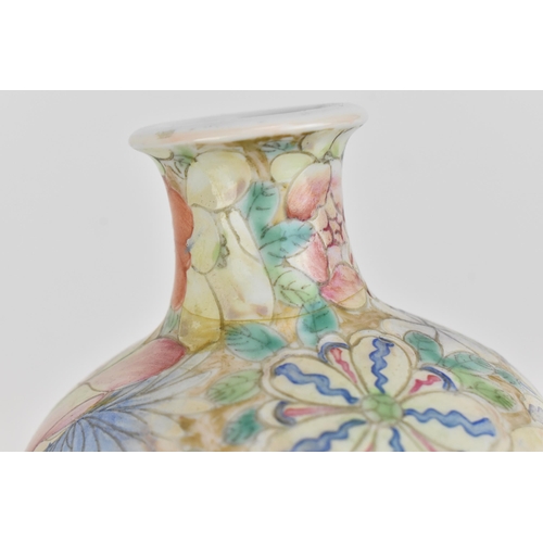 20 - A Chinese mille fleurs vase, Republic period, of ovoid shape decorated with large blooms and foliage... 