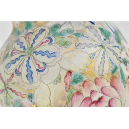 20 - A Chinese mille fleurs vase, Republic period, of ovoid shape decorated with large blooms and foliage... 