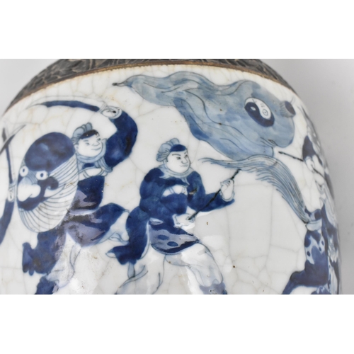 21 - A pair of Chinese blue and white crackle glazed porcelain vases, late 19th century/turn of century, ... 