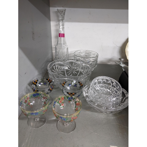 252 - A quantity of cut table glass to include a claret jug, four early 20th century enamelled glasses, po... 