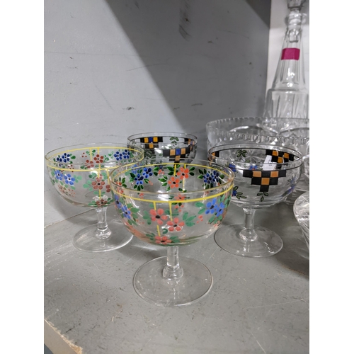 252 - A quantity of cut table glass to include a claret jug, four early 20th century enamelled glasses, po... 