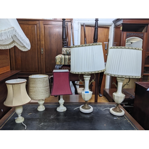 195 - A selection of lamps to include a pair of white onyx and gilt metal lamps with fabric shades, three ... 