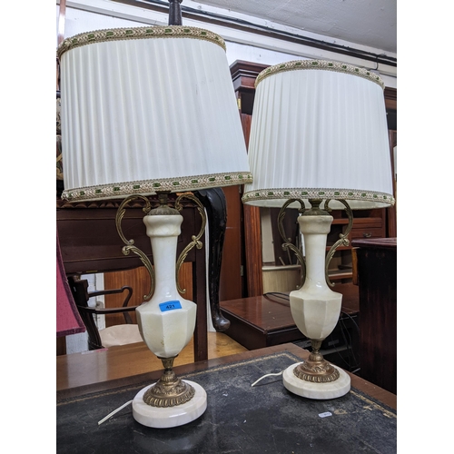 195 - A selection of lamps to include a pair of white onyx and gilt metal lamps with fabric shades, three ... 