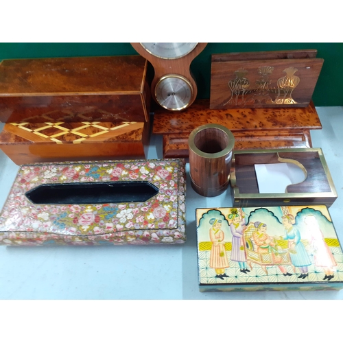 141 - A group of walnut and parquetry cigarette and other boxes and desk tidies, an Indian paper mace tiss... 