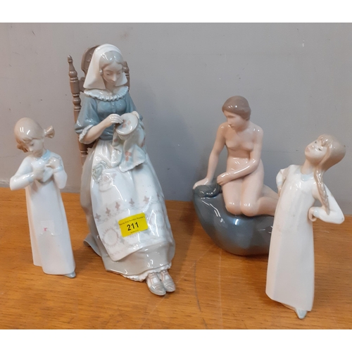 211 - Four late 20th Century figures comprising a Royal Copenhagen 'Little Mermaid', 2 small Lladro figure... 