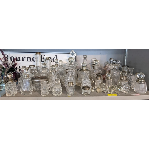 94 - Approximately 40 cut glass perfume bottles and jars
Location: 4:2