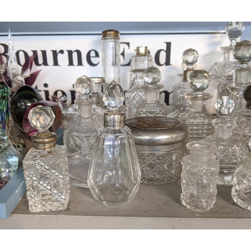 94 - Approximately 40 cut glass perfume bottles and jars
Location: 4:2