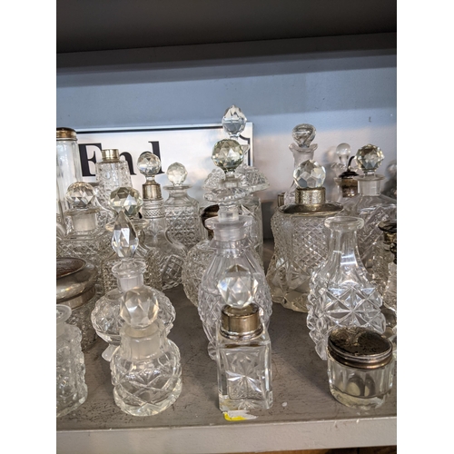 94 - Approximately 40 cut glass perfume bottles and jars
Location: 4:2